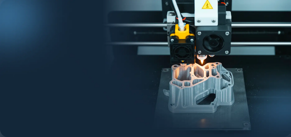 Close-up of a 3D printer extruder laying down a part mid-print